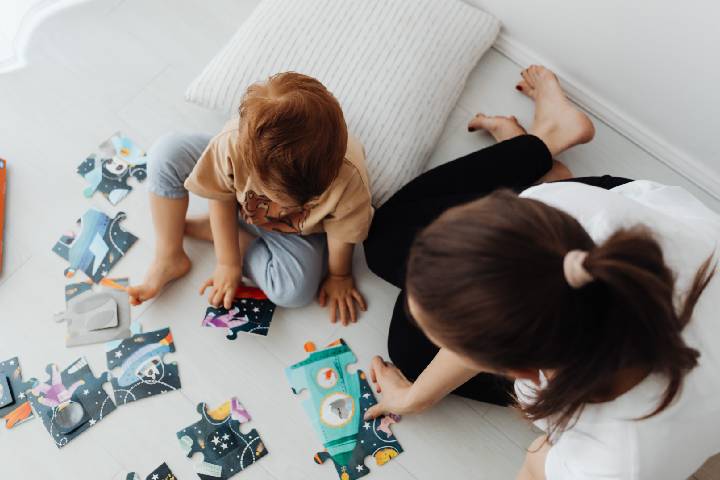 The Baby Playing a Riddle With His Mother